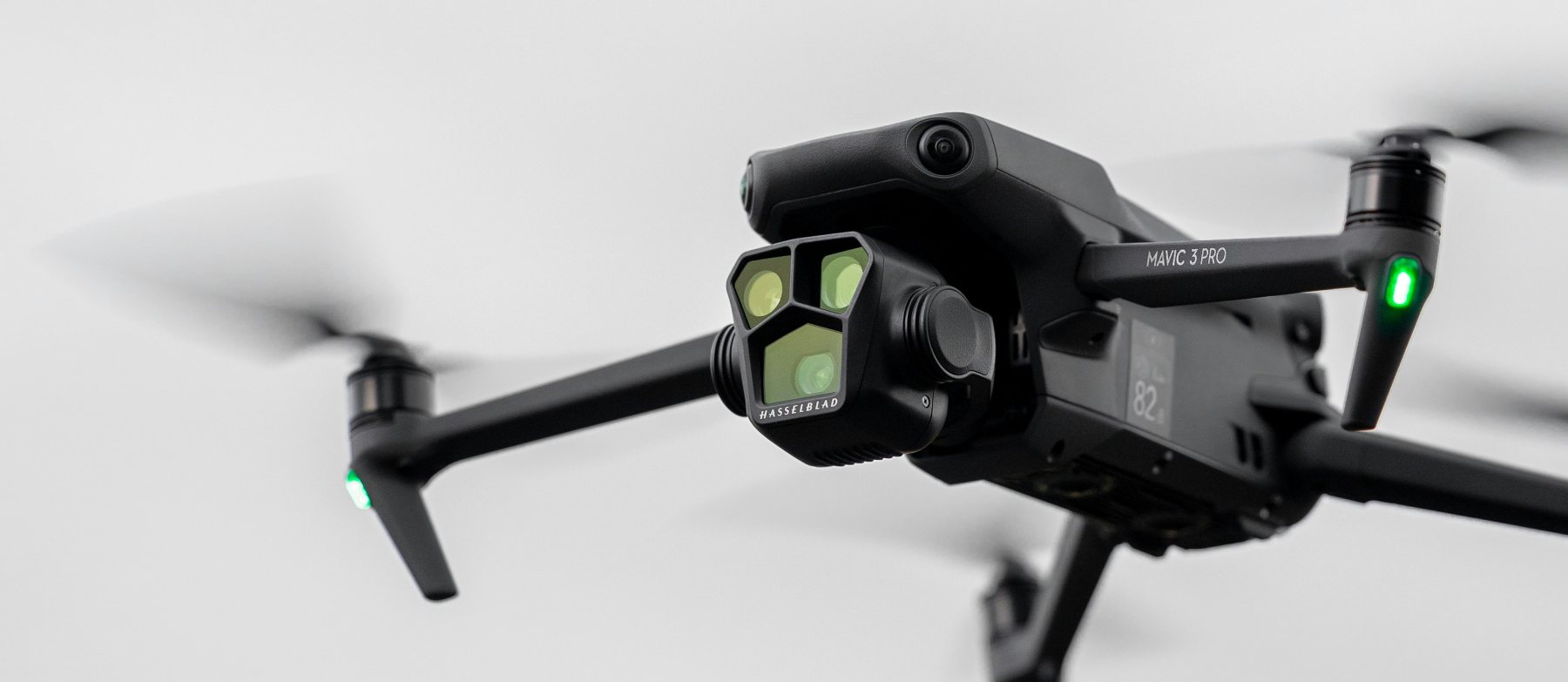 DJI Mavic 3 Pro drone in flight against a clean white sky